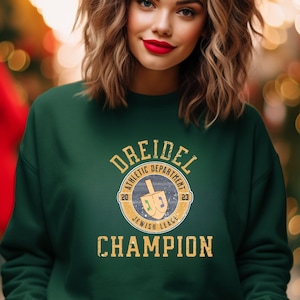 Spin into Celebration with the Dreidel Champion Chanukah Sweatshirt!