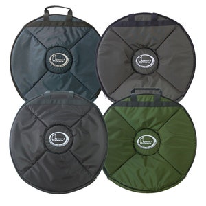 May include: Four round, padded, zippered carrying cases for musical instruments. The cases are in different colors: dark green, gray, and two shades of green. Each case has a black handle and a white logo that says "Bauer & Brown" with a musical note.