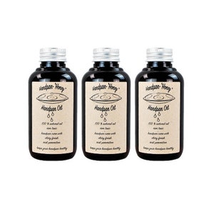 May include: Three 100% natural oil handpan oil bottles with black labels and silver lids. The labels feature a handpan illustration and the text "Handpan-Honey" and "Handpan Oil".
