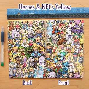 May include: A spiral-bound notebook with a yellow cover featuring a colorful cartoon illustration of various characters. The notebook is open, displaying the front and back covers. The text "Heroes & NPCs Yellow" is at the top. A blue ruler and a pen are also visible.