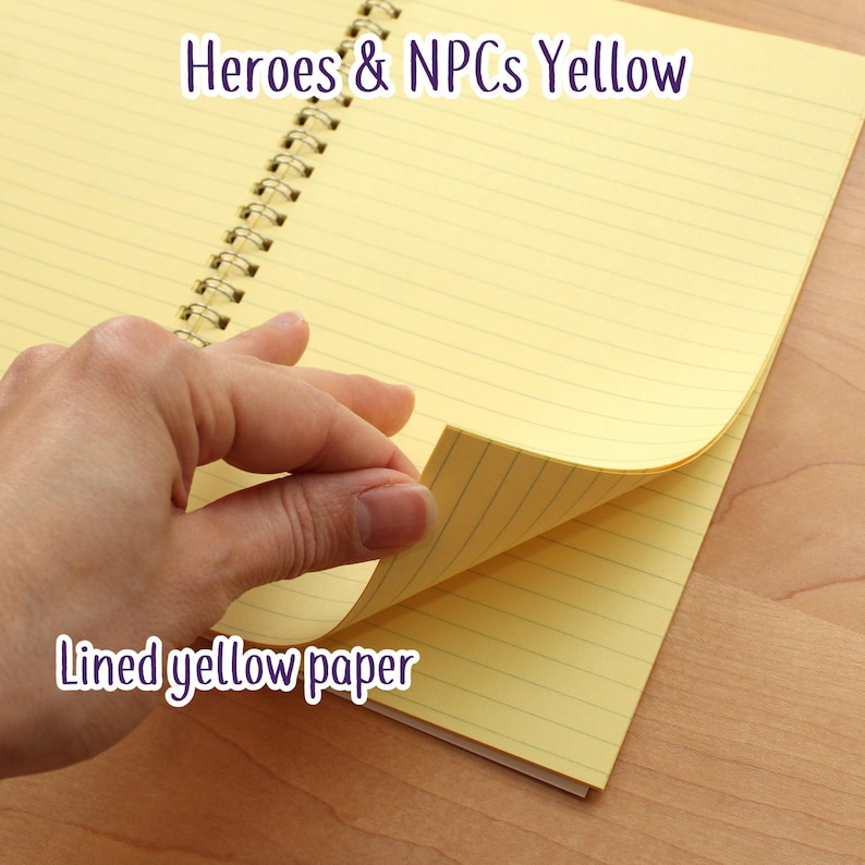 May include: A yellow spiral-bound notebook with lined paper. The text "Heroes & NPCs Yellow" and "Lined yellow paper" are visible. A hand is turning a page, revealing the yellow paper.