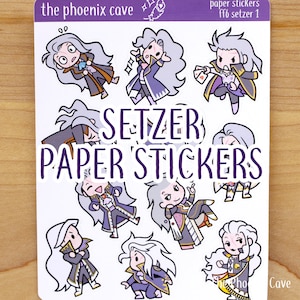 May include: A sheet of paper stickers featuring a cartoon character named Setzer from the Final Fantasy VI video game. The stickers are printed on white paper with a purple border and the text "Setzer Paper Stickers" in large, bold letters.