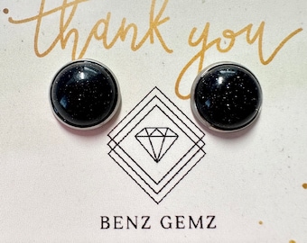 May include: A pair of black stud earrings with silver settings. The earrings are on a white card with the text "thank you" and "Benz Gemz" written in gold lettering. The card also has the text "Etsy: BenzGemzBoutique" written in green lettering.
