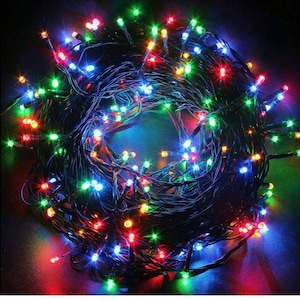 May include: A string of multi-coloured Christmas lights with red, green, blue and yellow bulbs. The lights are tangled together in a circle.