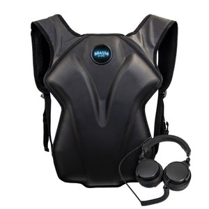 May include: A black bass pak vest with a logo that says "BASS pak" and a pair of black headphones.