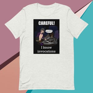 Hexes & Hairballs T-Shirt – Funny Witchcraft Cat Graphic Tee for Magic Lovers | Unisex t-shirt