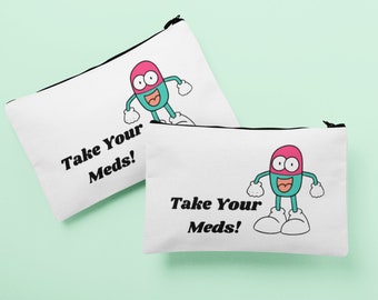 May include: Two white zippered pouches with a cartoon pill character and the text "Take Your Meds!" printed on them.