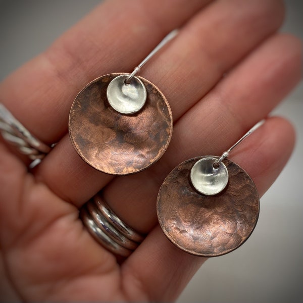 Dangle disc earrings handmade from copper and silver . Domed and texturized for a great look and perfect for everyday wear. Made in USA.