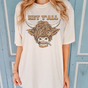 Ivory Comfort Colors Highland Cow Shirt ,Cowgirl Rodeo t-shirt, Boho t-shirt, oversized shirt, garment dyed shirt, bull tshirt, hey yall tshirt, cute cow shirt