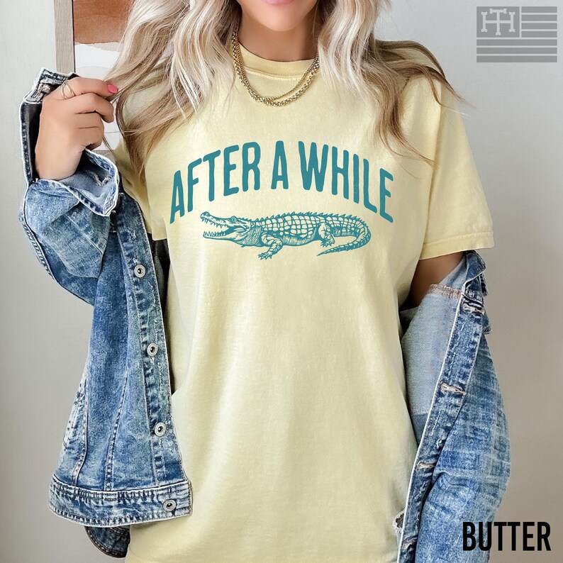 Funny 'After a While, Crocodile' t-shirt with playful crocodile graphic, perfect for fans of humorous, sarcastic, and novelty tees. Great gift for Mother's Day or anyone who loves witty sayings, Comfort Colors Butter Shirt