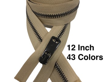 May include: Tan-colored zipper with a black metal pull and teeth. The zipper is 12 inches long. The text on the image says "12 Inch 43 Colors".