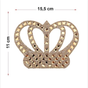 May include: A gold crown-shaped rhinestone applique measuring 15.5 cm wide and 11 cm tall.