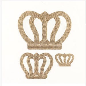 May include: Three gold crown-shaped iron-on patches. The largest crown is at the top, the middle crown is below it, and the smallest crown is to the right of the middle crown.