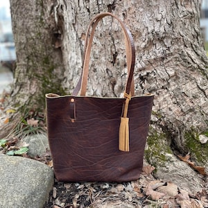 kate spade brown purse with tassel