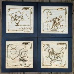 May include: Four wooden framed squares with a black background and a light wood interior. Each square features a different zodiac sign with a cartoon creature and constellation. The signs are Aquarius, Pisces, Taurus, and Sagittarius.
