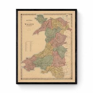 May include: An antique map of Wales, printed in black, red, green, and yellow ink on a cream-colored background. The map shows the counties of Wales and includes a key with the names of each county.