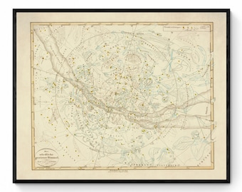 May include: A vintage star chart of the northern hemisphere, printed on cream paper with a light blue background. The chart shows the constellations and stars, with the names of the constellations written in German. The chart is framed in a black frame.