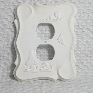 May include: White ceramic double light switch cover with a mushroom and butterfly design.