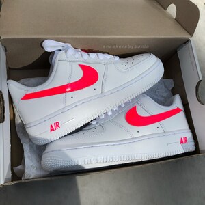 white and neon pink air force 1