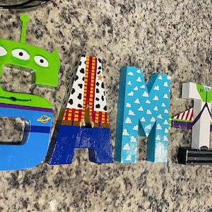 Two infinity and beyond Toy story themed letter signs