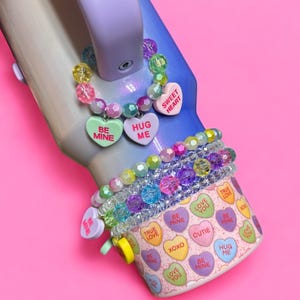 Conversation Hearts Cup Handle Charm. Valentine accessories. Ruby Hearts. Sweethearts. Single item. Colors and saying on hearts will vary.