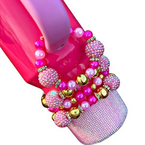 Pink Parade Cup Handle Charm. Single item. Other items pictured are sold separately.