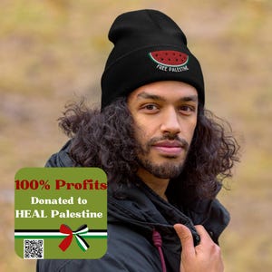 May include: Black beanie with a watermelon graphic and the text "Free Palestine". 100% of profits are donated to HEAL Palestine. The beanie features a green, white, and black Palestinian flag with a red ribbon.