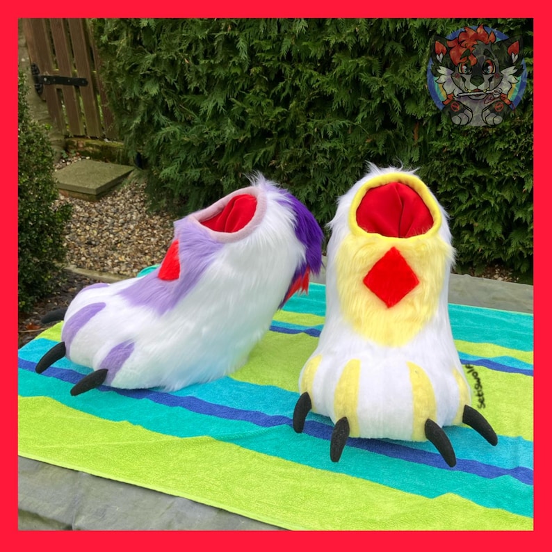 May include: A pair of furry, cartoon-style feet in white, purple, yellow, and red. The feet have black claws and are designed to look like animal paws. The interior is red, and the exterior is a mix of white, purple, and yellow.