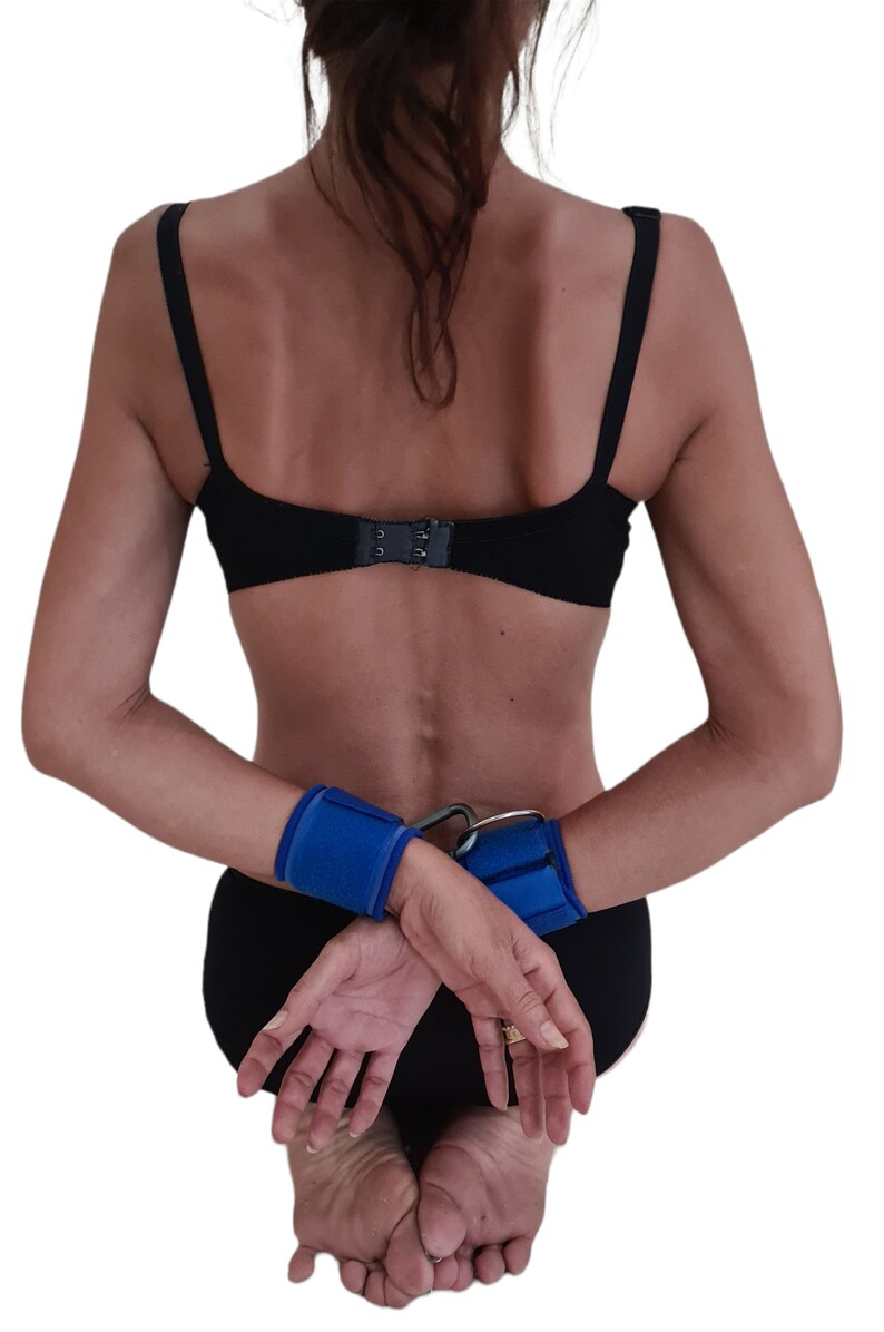 Abdl. BLUE RESTRAINTS. A Pair of Lockable Wrist Straps With Drings