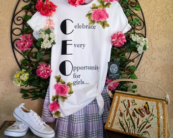 Celebrate all girls and boys be colorful and spirited. Color outside the lines in this folkloric embroidered appliqued statement t-shirt.