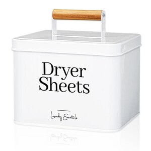 May include: White metal storage container with a wooden handle. The container has a black label that says "Dryer Sheets" and "Laundry Essentials".