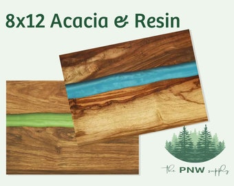May include: Two 8x12 inch acacia wood chopping boards with a green and blue resin inlay. The boards are shown against a light green background. The text "The PNW supply" is visible in the bottom right corner of the image.