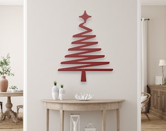 May include: A red metal Christmas tree wall art with a star on top. The tree has a modern, minimalist design with horizontal lines. The artwork is mounted on a light-colored wall in a living room setting.
