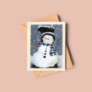Carte de Noël bonhomme de neige enneigé