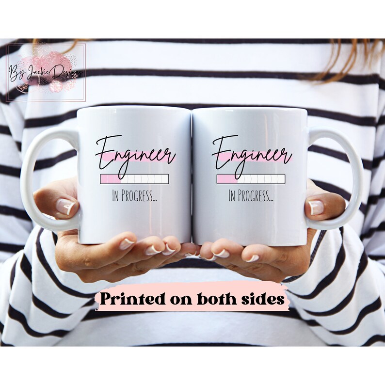 May include: Two white ceramic mugs with black text that reads "Engineer" and a pink progress bar that says "In Progress..." Printed on both sides.