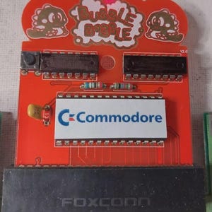 Commodore 64 Bubble Bobble pla 906114-01 SID C64 C128 - Cartridge GOLD (NEU)