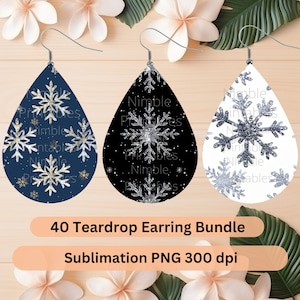 May include: A set of 40 teardrop-shaped earring blanks with a snowflake design. The earrings are available in three colors: navy blue, black, and white. The snowflakes are silver with glitter. The text "40 Teardrop Earring Bundle" and "Sublimation PNG 300 dpi" is visible at the bottom of the image.