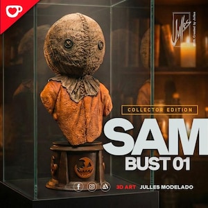 May include: A Sam bust 01 collector edition figurine featuring a burlap-textured head with button eyes and a stitched mouth, wearing an orange garment. The bust sits on a dark circular base with a carved jack-o'-lantern icon inside a glass display case.
