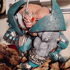 May include: A set of three ceramic nesting bowls in shades of blue, green, and white. The bowls feature a speckled glaze and a simple, modern design. The largest bowl measures approximately 6 inches in diameter.