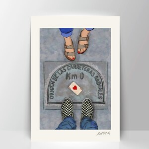 May include: A couple stand on a grey pavement with a manhole cover that reads "ORIGEN DE LAS CARRETERAS RADIALES Km 0". A playing card with a red heart is placed on the manhole cover. The man is wearing checkered Vans shoes and blue jeans. The woman is wearing brown sandals.