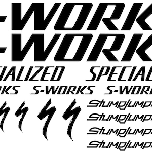 Pode incluir: Folha de adesivos preto e branco com as palavras "S-Works" e "Specialized" e um gráfico de raio estilizado. A folha também inclui as palavras "Stumpjumper" repetidas quatro vezes.
