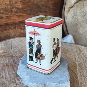 Vintage Saturnus Yugoslavia tin with motifs of folk costumes