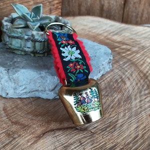 Vintage decorative fake cowbell on ribbon, souvenir from Schwartzwald