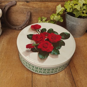 Vintage red roses round tin