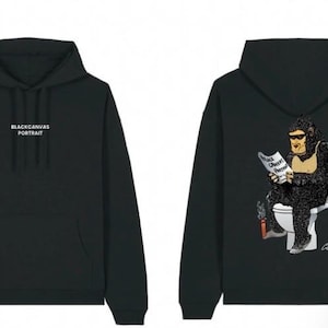 May include: A black hooded sweatshirt featuring the text BLACKCANVAS PORTRAIT on the front. The back displays a graphic of a gorilla wearing sunglasses, sitting on a toilet, reading a newspaper, and holding a lit cigarette with a signature.