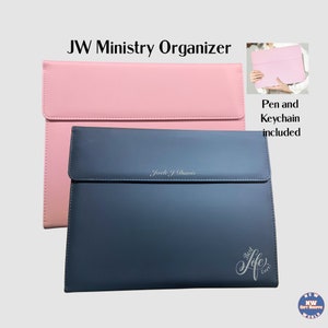 May include: Two JW Ministry Organisers, one pink and one blue, with the text "Jock J Davis" and "Best Life Ever!" engraved on them. Pen and keychain included.