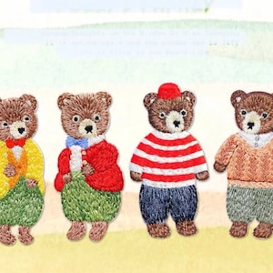 May include: Four embroidered iron-on patches of brown bears wearing different outfits. The bears are wearing a yellow jacket, a red jacket, a striped sweater, and a brown sweater.