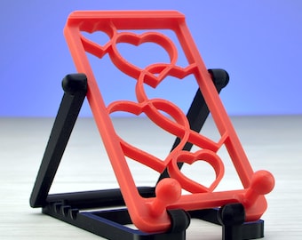Foldable Phone Stand – 5 Tilt Positions, Cute Hearts Pattern, Lightweight & Stable, Romantic Gift Idea.