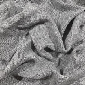 May include: Close-up of a gray, textured fabric with a woven pattern. The fabric is wrinkled and folded, creating a soft, drapey look.