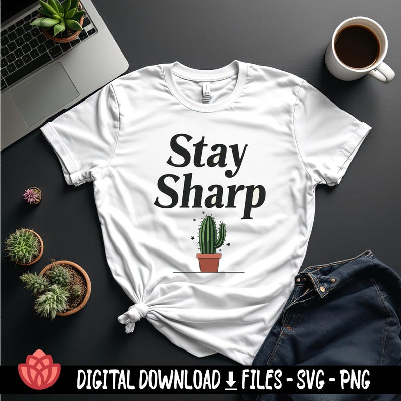 May include: White t-shirt with the text "Stay Sharp" in black lettering. A small cactus in a brown pot is below the text.